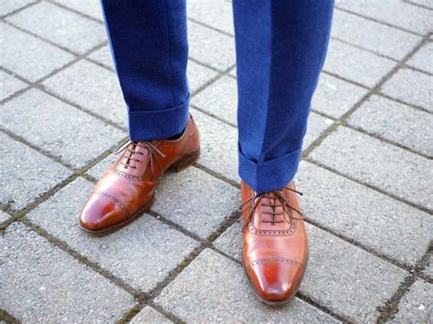 brown shoes with blue pants.